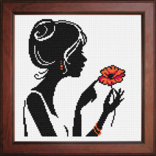 Silhouette of a girl with a poppy